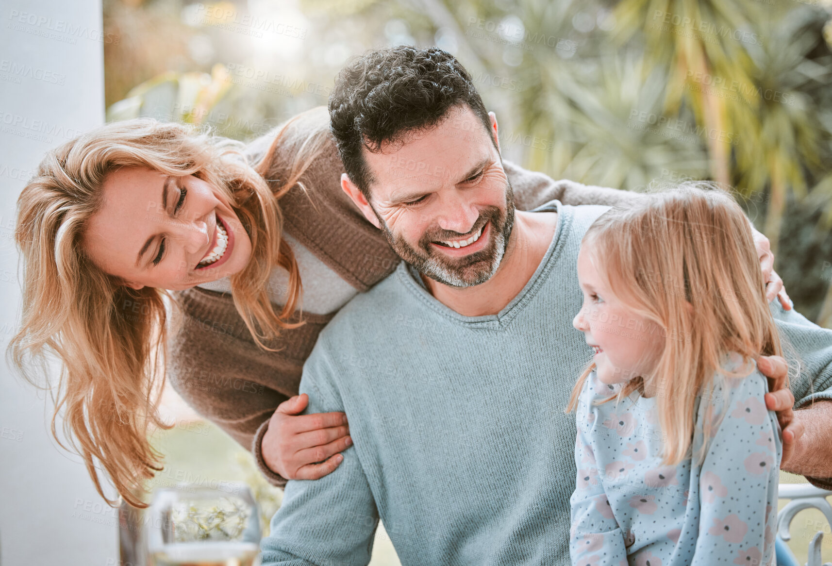 Buy stock photo Mom, dad and kid on terrace for lunch in garden together with smile, bonding and outdoor family love. Mother, father and happy girl in backyard with health, wellness and fun weekend brunch at home