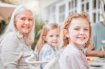 Buy stock photo Shot of two girls and their grandma sitting at a tablet at home