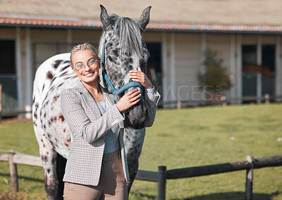 Buy stock photo Portrait of an attractive woman posing with a horse in an enclosed pasture on a farm