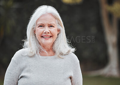 Buy stock photo Shot of a senior woman standing outside