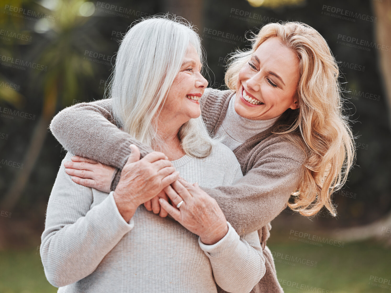 Buy stock photo Embrace, woman and senior mom in garden with smile, pride and gratitude in outdoor bonding together. Happy family, generation and elderly mother with daughter in backyard for hug, support and love