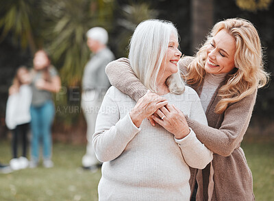 Buy stock photo Smile, woman and senior mom in garden with embrace, pride and gratitude in outdoor bonding together. Happy family, generation and elderly mother with daughter in backyard for hug, support and love