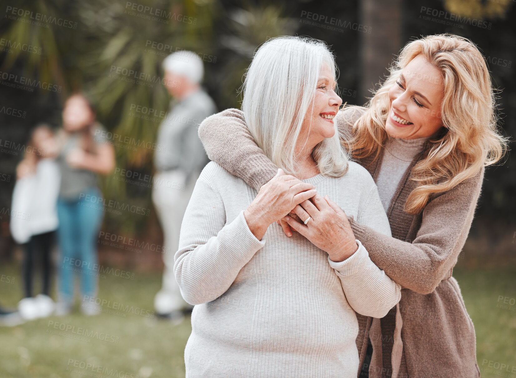 Buy stock photo Smile, woman and senior mom in garden with embrace, pride and gratitude in outdoor bonding together. Happy family, generation and elderly mother with daughter in backyard for hug, support and love