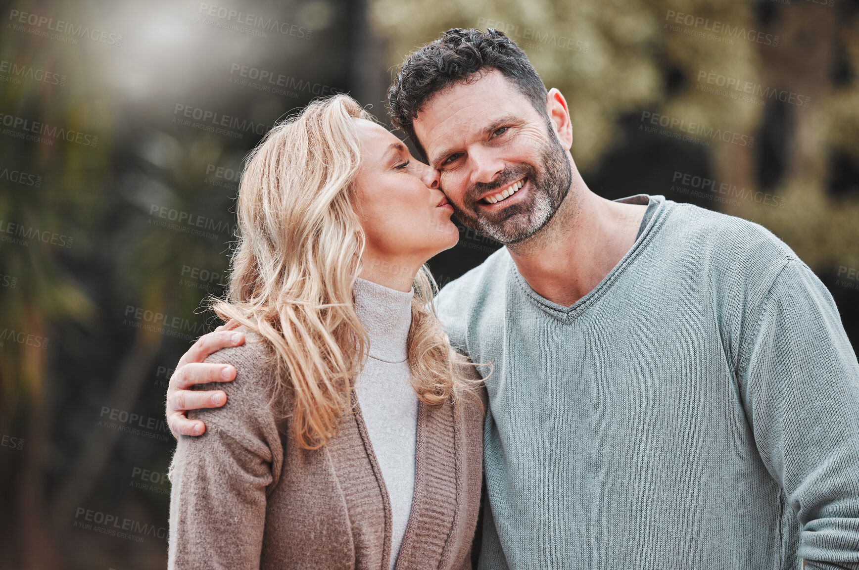 Buy stock photo Mature couple, kiss and support in portrait, outdoor love and affection for spouse on holiday. Happy people, hug and vacation for bonding on travel, trust and countryside security in commitment