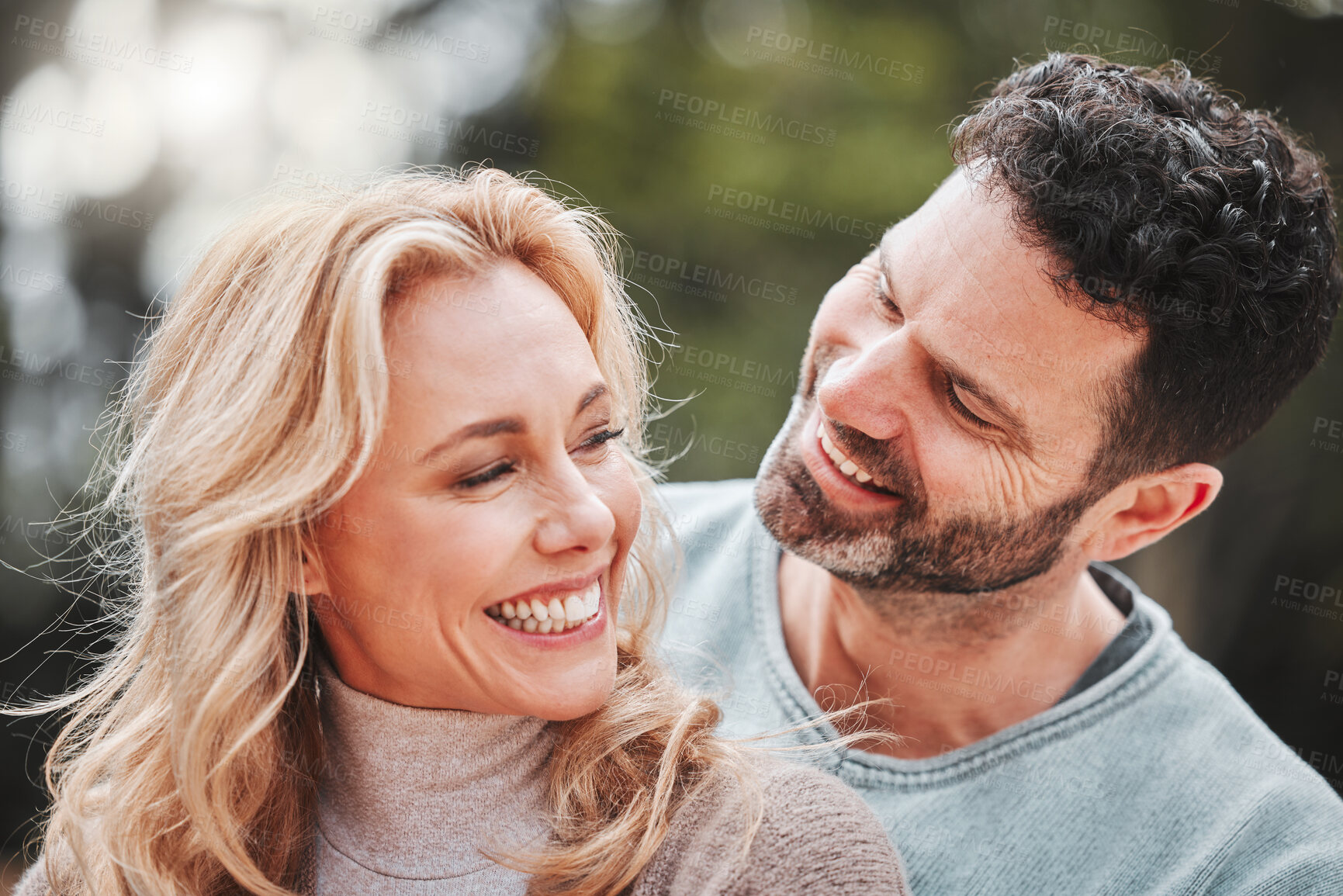 Buy stock photo Couple, relax and hug for outdoor laughter, love and affection for spouse on holiday. Mature people, funny humor and vacation for bonding on travel, embrace and countryside security in commitment