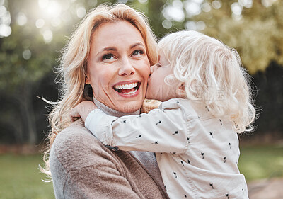 Buy stock photo Kiss, mom and child in garden with smile, embrace and gratitude with outdoor bonding together. Love, mother and son in backyard with hug, care and support with weekend fun in nature for happy family