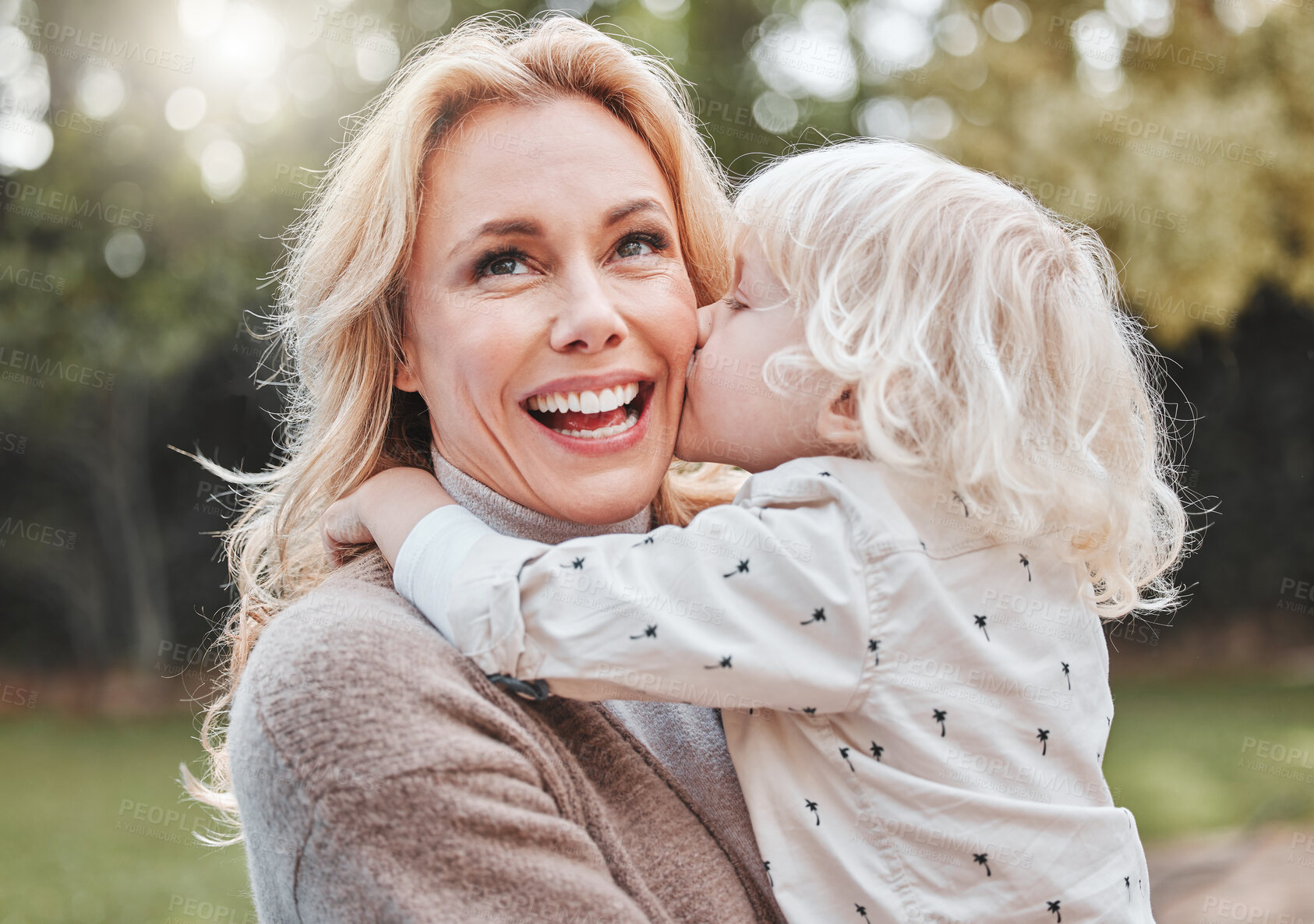 Buy stock photo Kiss, mom and child in garden with smile, embrace and gratitude with outdoor bonding together. Love, mother and son in backyard with hug, care and support with weekend fun in nature for happy family