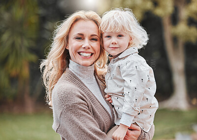 Buy stock photo Portrait, mom and child in garden with smile, embrace and support with outdoor bonding together. Love, mother and son in backyard with hug, care and health with weekend fun in nature for happy family