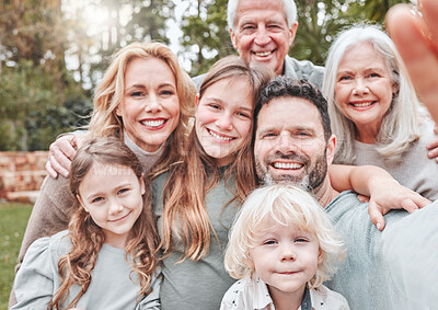 Buy stock photo Shot of a multi-generational family posing together outside