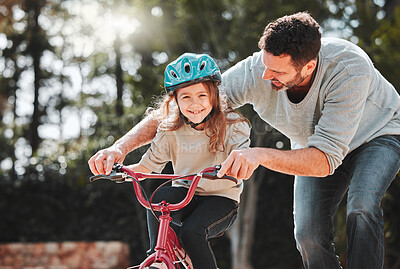 Buy stock photo Dad, little girl and learning with ride on bicycle for teaching, lesson or practice at outdoor park. Happy father, daughter or child with smile on bike for bonding, training or cycling in nature