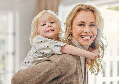 Buy stock photo Shot of a mature mother enjoying time with her son at home