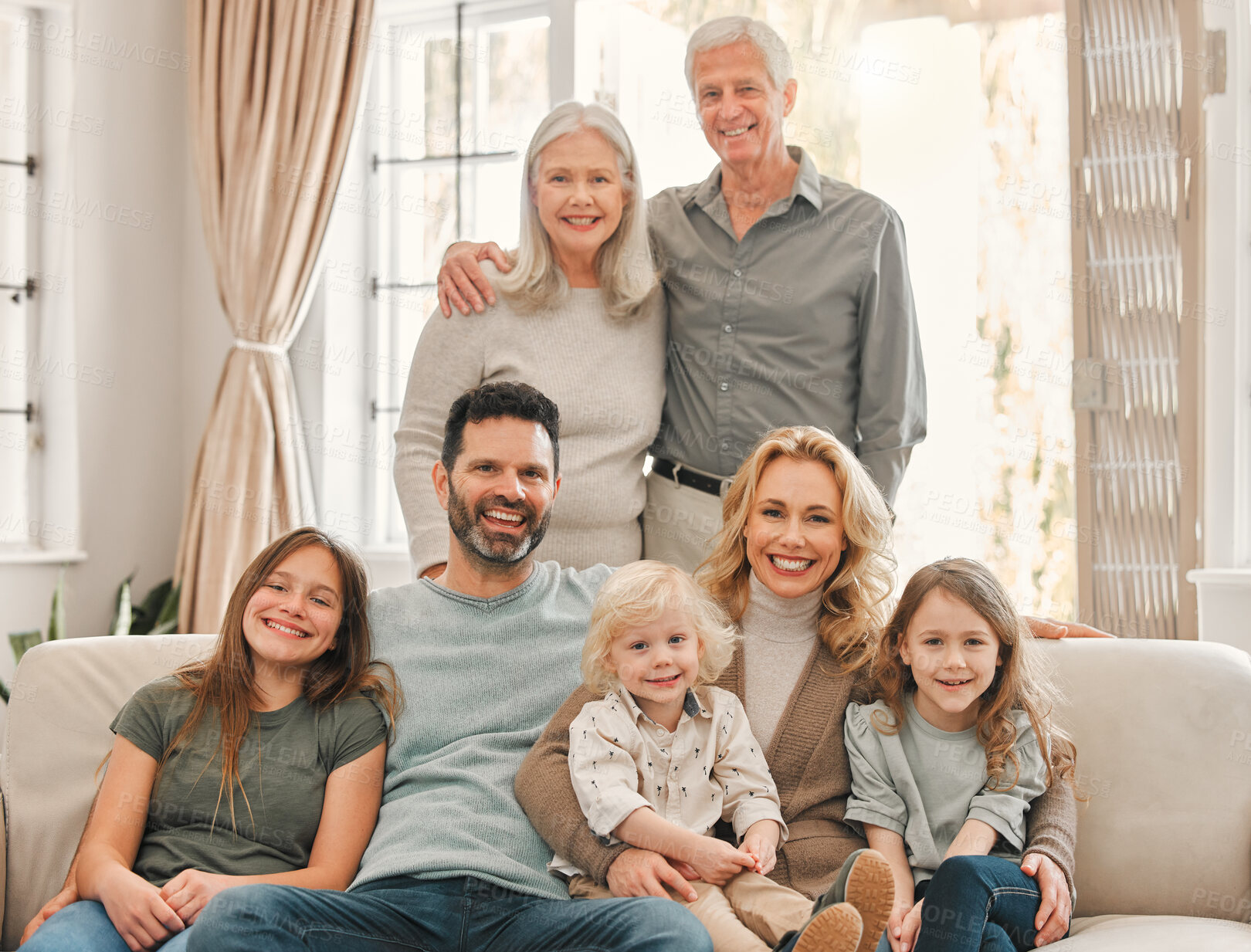 Buy stock photo Shot of a family relaxing together at home