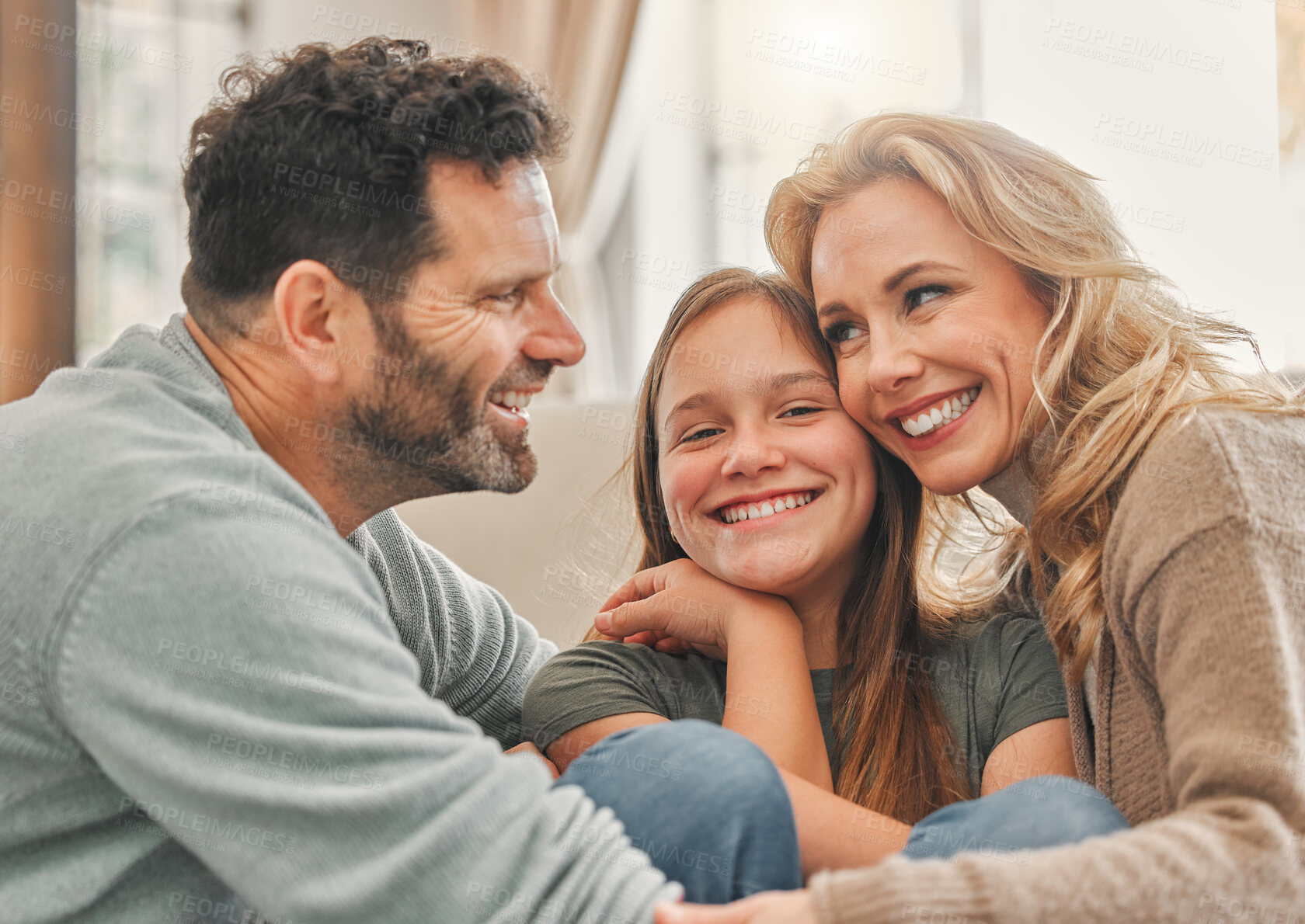 Buy stock photo Parents, girl and happy in home on couch for bonding with fun, support and care for child development. People, family and kids with smile for love or relationship to relax for wellbeing and wellness