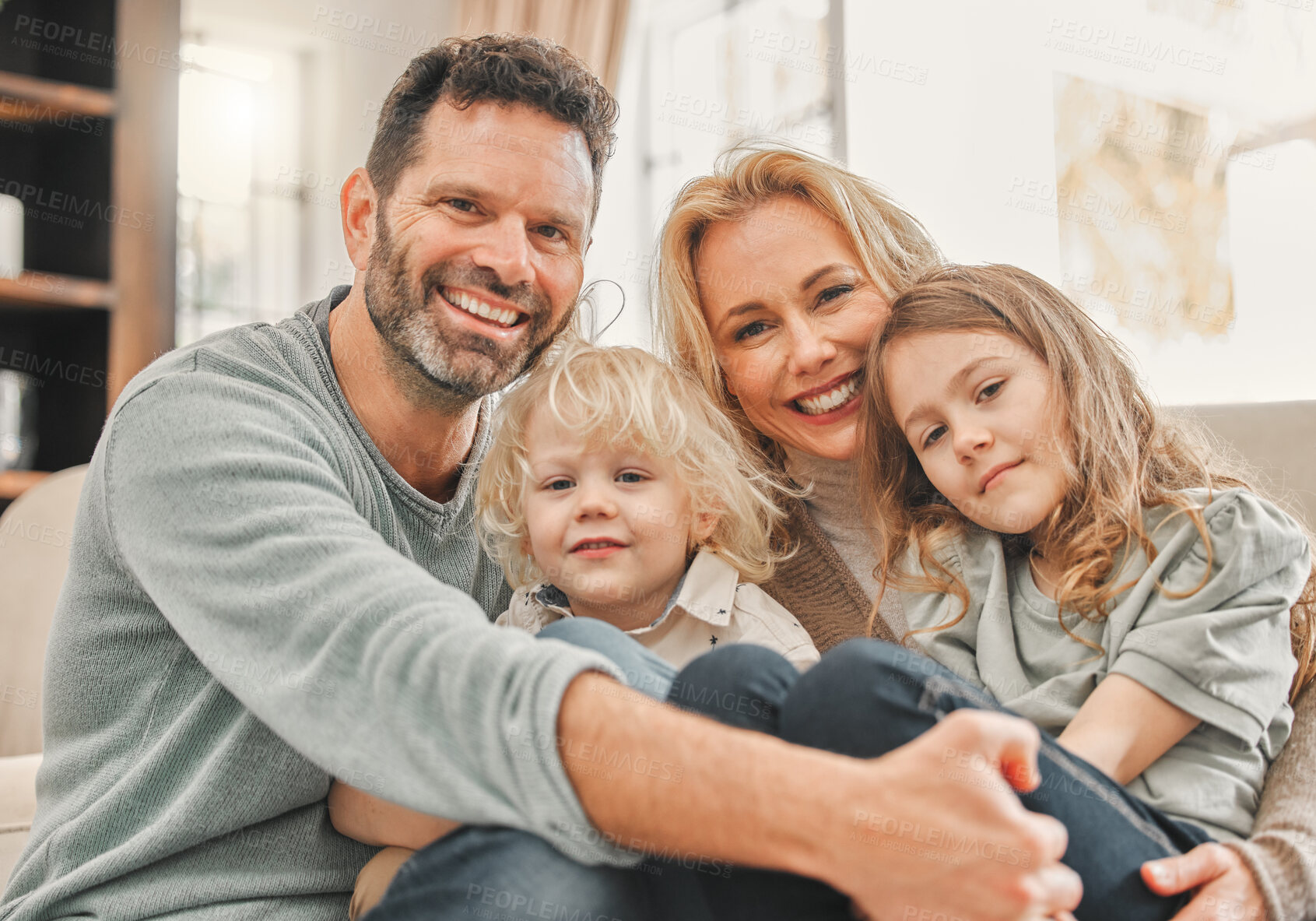 Buy stock photo Portrait, happy family and children with parents in home for care, relax or bonding together. Face, mother and father with kids in living room for support, love and connection with siblings on sofa