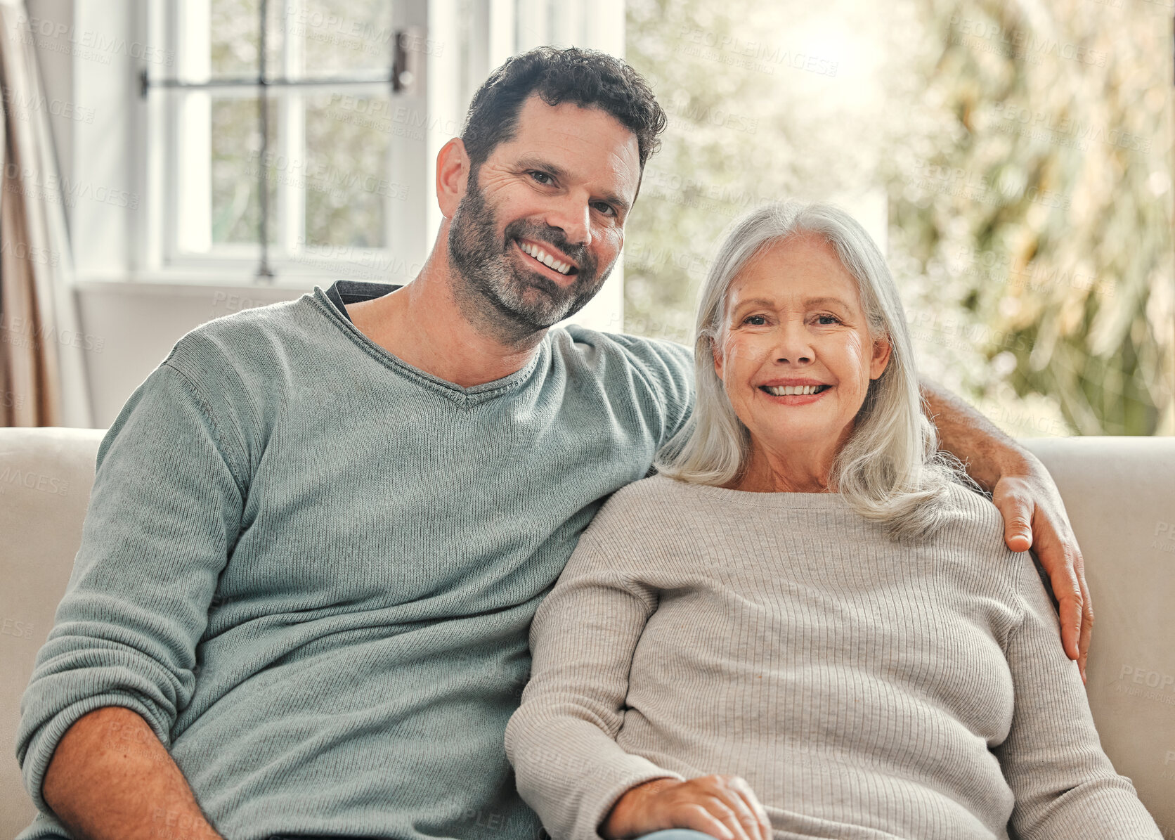 Buy stock photo Senior mother, son and happy in home on sofa in living room for bonding, support and care with visit. People, family and parent with smile on portrait on couch on break to relax, fun and peace