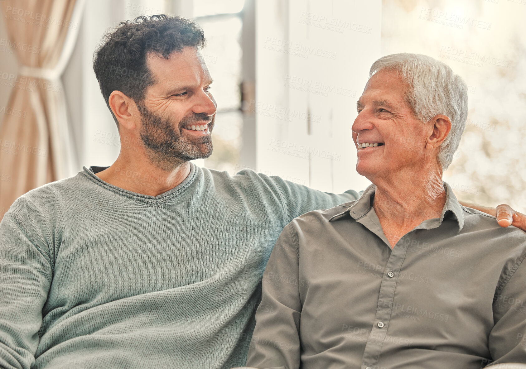 Buy stock photo Shot of a father and son spending time together at home