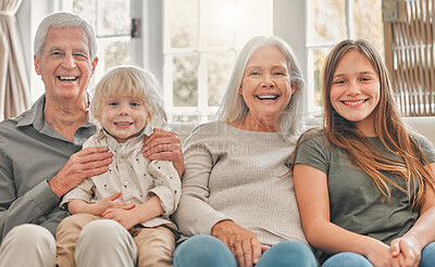 Buy stock photo Shot of a brother and sister spending time with their grandparents at home