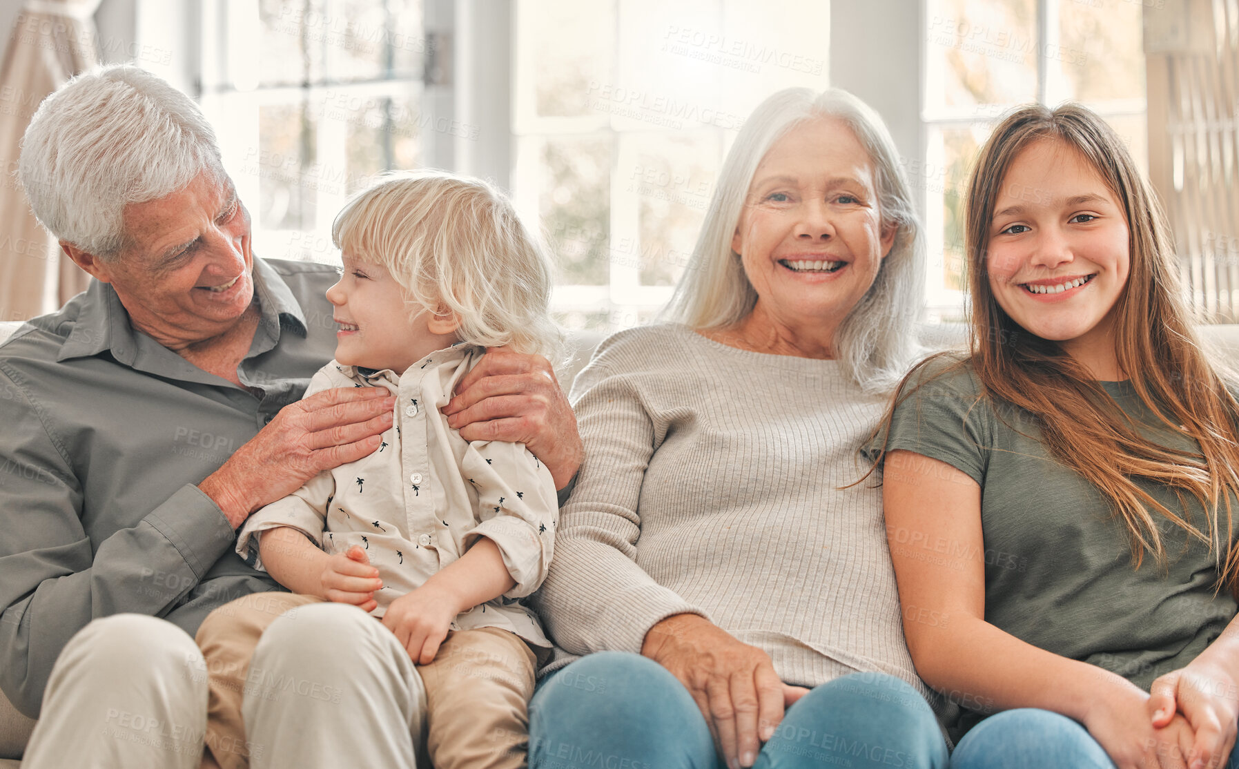 Buy stock photo Grandparents, kids and portrait in family home or lounge and together in morning for holiday. Hug, children and retirement or happy in living room for relax, smile and love or care for senior people