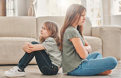 Buy stock photo Angry, children and fight on floor in living room with arms folded for argument and problem. Family, teen or girl and frustrated in lounge or home for conflict, anger and back together for trouble