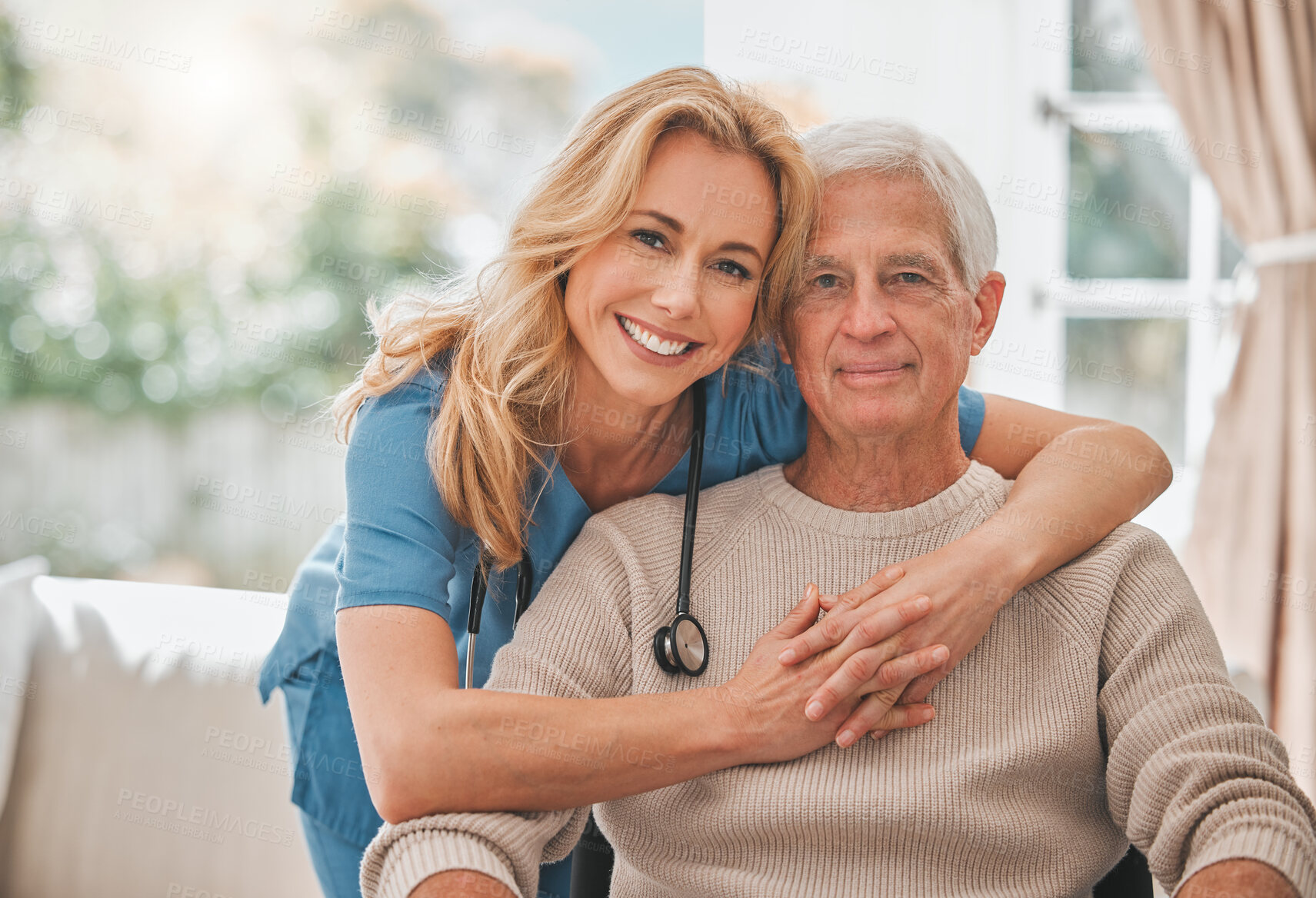 Buy stock photo Shot of a young nursing home nurse hugging her male elderly patient