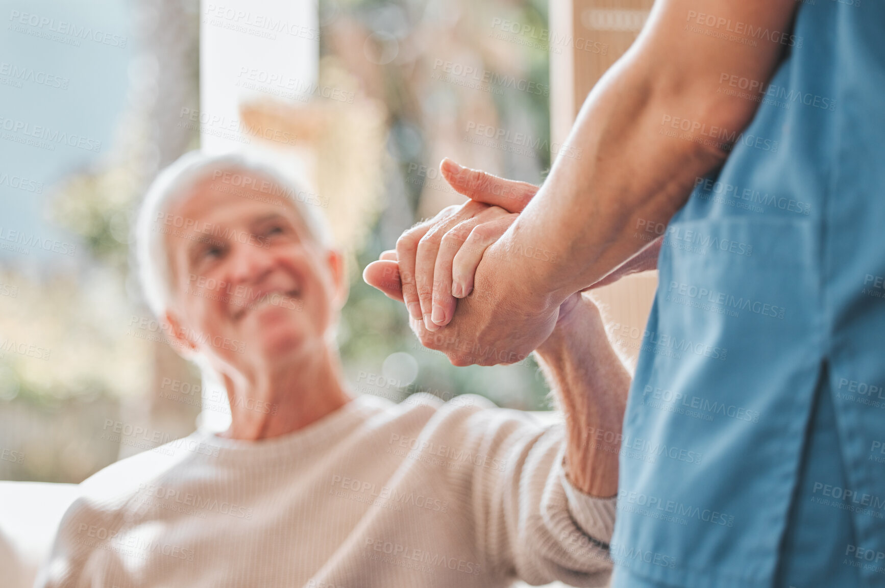 Buy stock photo Shot of a nurse offering her elderly male patient support