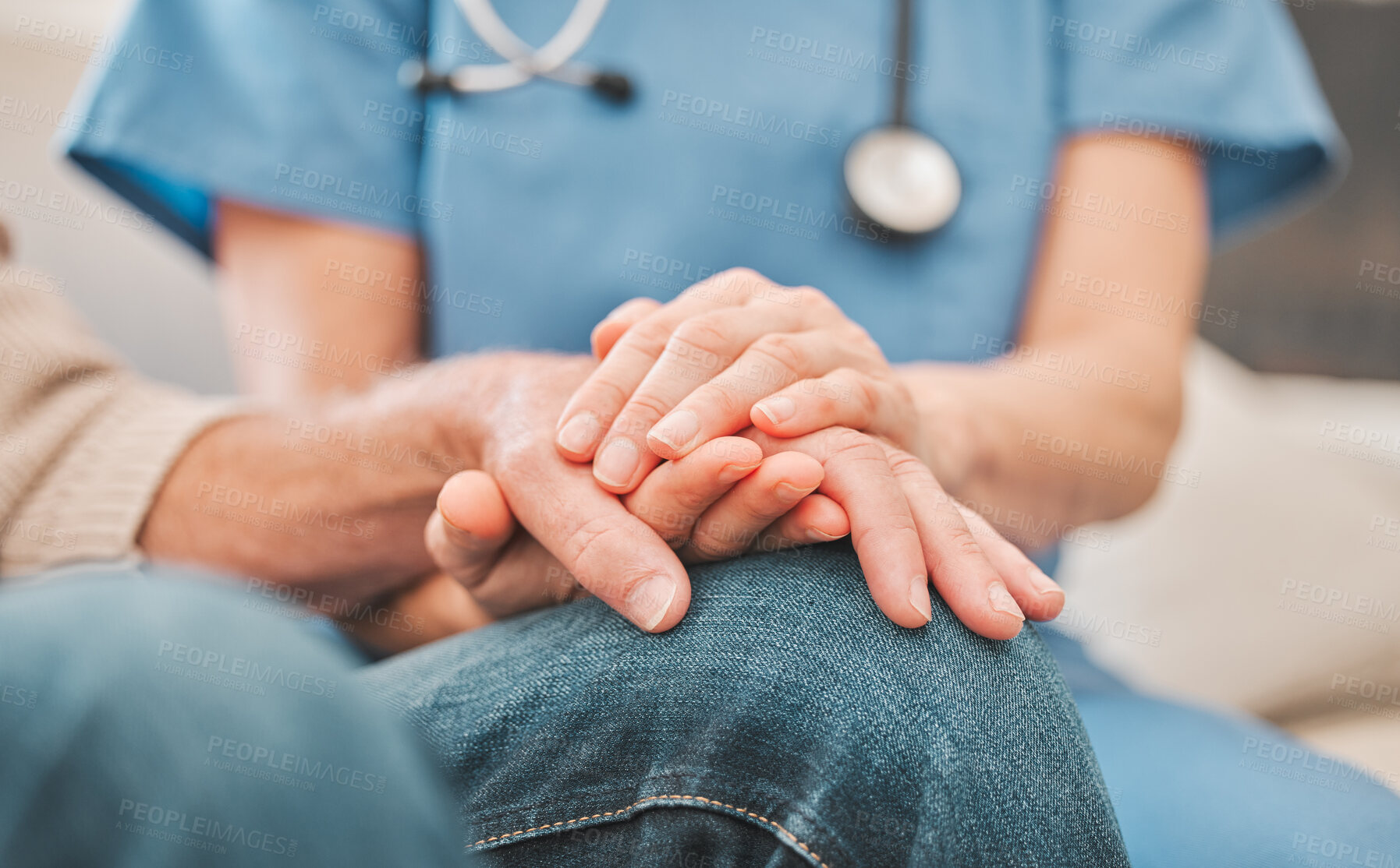 Buy stock photo Shot of a nurse offering her elderly male patient support