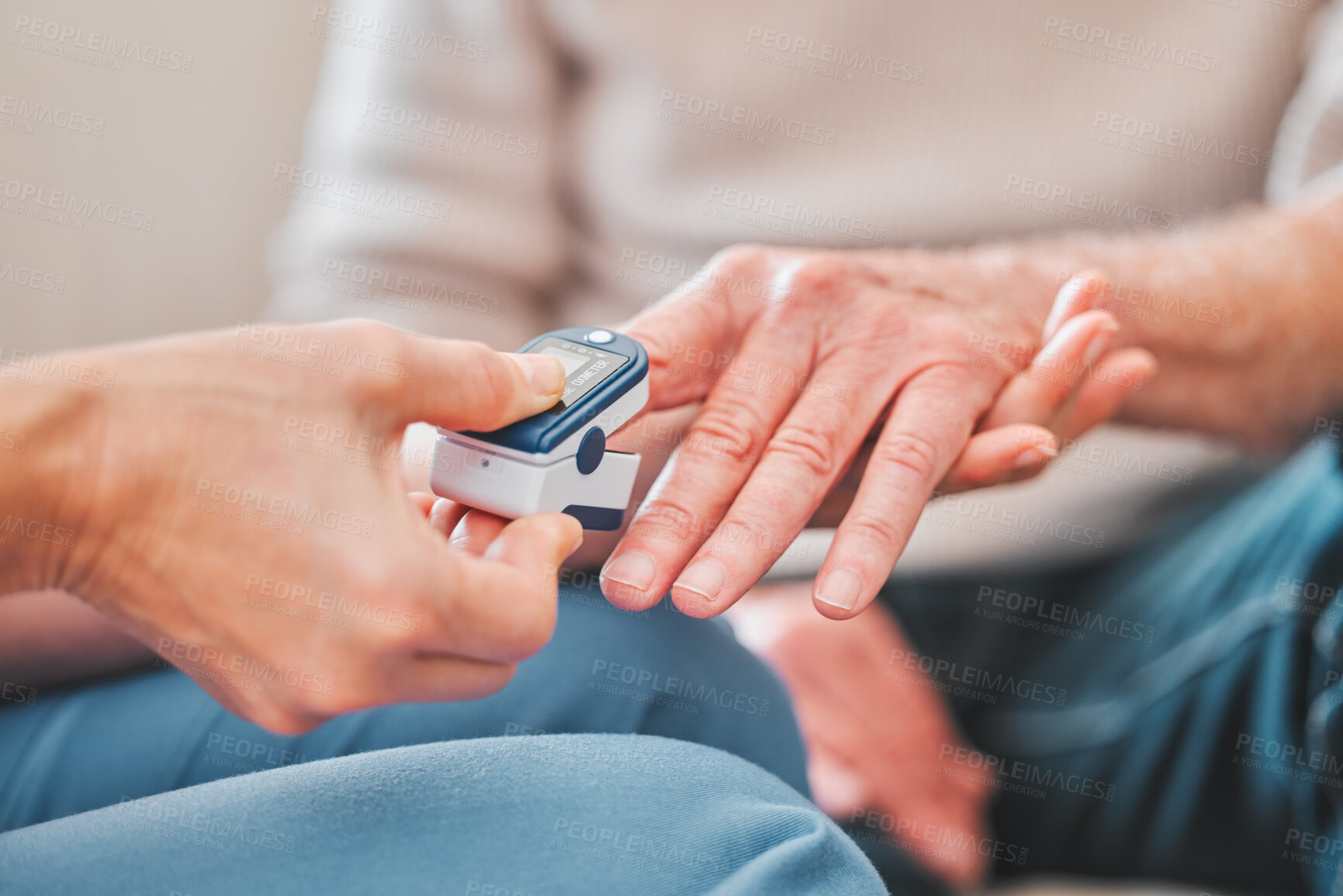 Buy stock photo Shot of a nurse checking the blood pressure of a mature patient