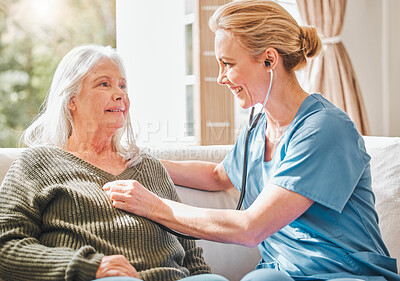 Buy stock photo Woman, senior and nurse with stethoscope for listening, healthcare and wellness with medical tool. Heart rate, sofa and check up in retirement home, assessment and help with caregiver expert