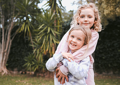 Buy stock photo Shot of two adorable little girls having fun in a garden