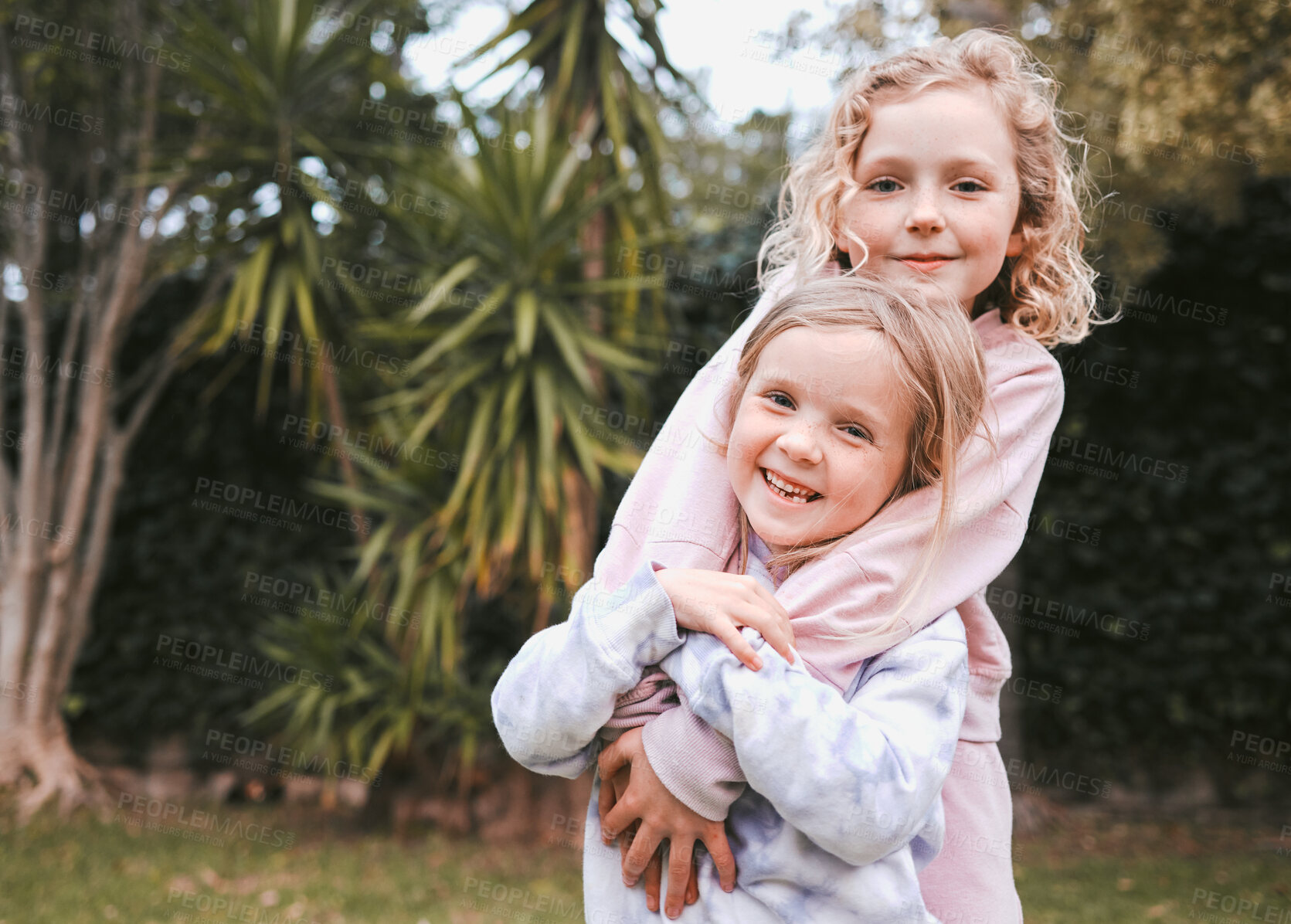 Buy stock photo Garden, happy and siblings in portrait with hug, playful and bonding together with childhood games in park. Outdoor, children or girls with embrace for connection, development and care in backyard