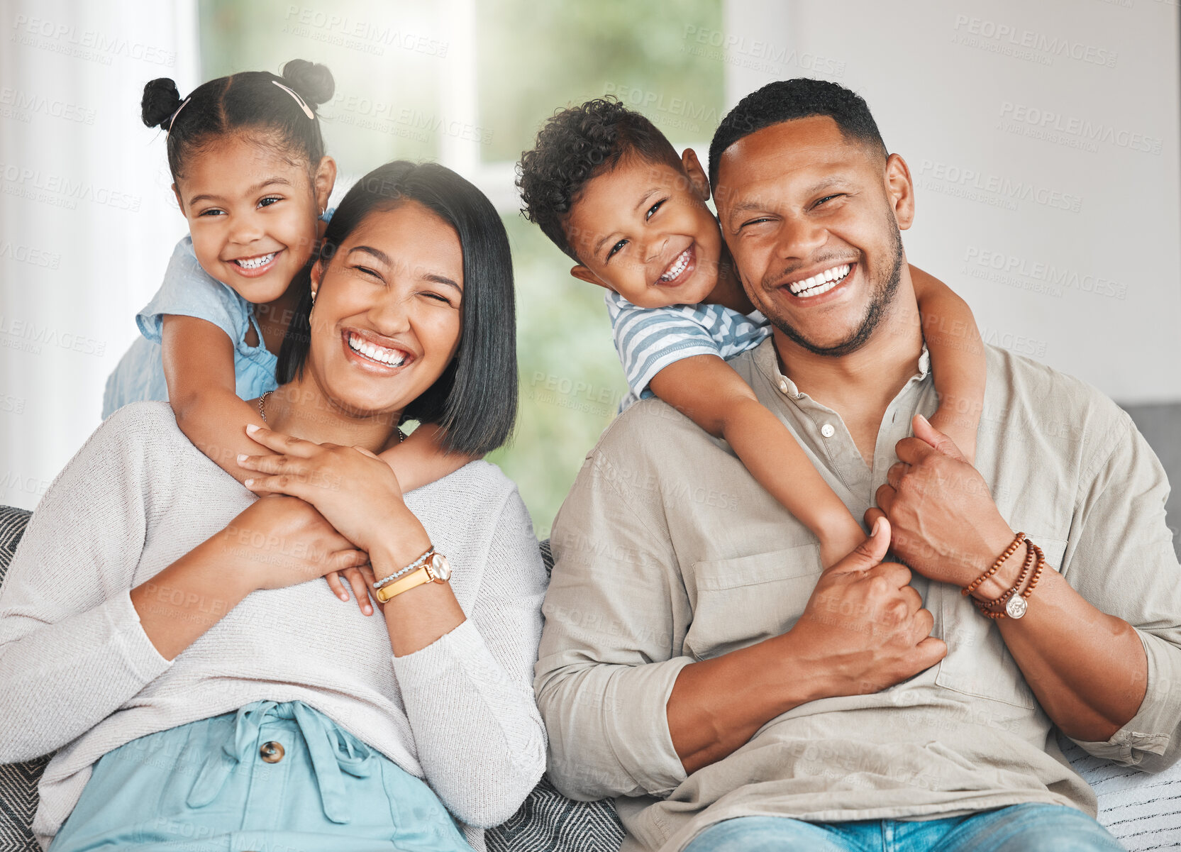 Buy stock photo Family, portrait and hug in living room on couch for bonding, relax and relationship together on weekend. Mother, father and children with smile in house on sofa for love, care or support as people