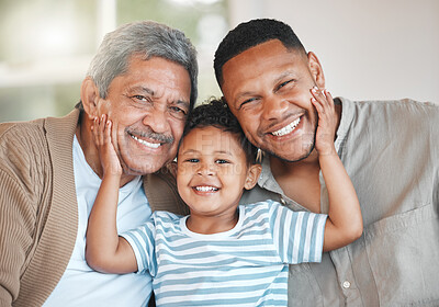 Buy stock photo Portrait of a mature man sitting with his son and holding his grandson at home