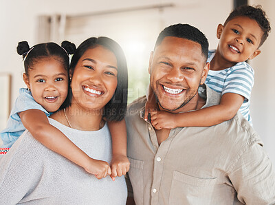 Buy stock photo Portrait of a beautiful young family bonding while spending time together at home