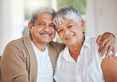 Buy stock photo Shot of a happy senior couple relaxing on the sofa at home