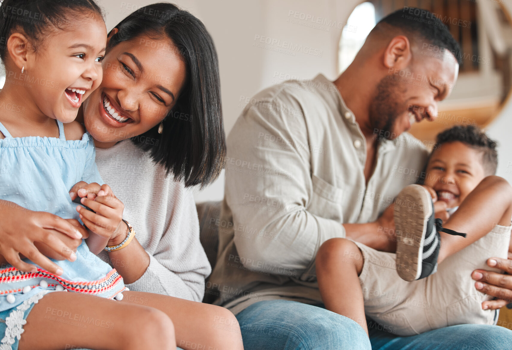 Buy stock photo Mother, dad and play with children on couch for bonding with comfort, love and connection for embrace or affection. Mom, father and kids or siblings with fun laughter, family home and happy together.