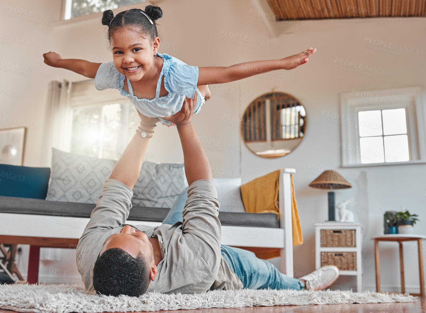 Buy stock photo Dad, girl portrait and airplane game on floor for love, relationship care and bonding together in home. Father, young daughter and flying fantasy for balance in lounge with energy, support and trust