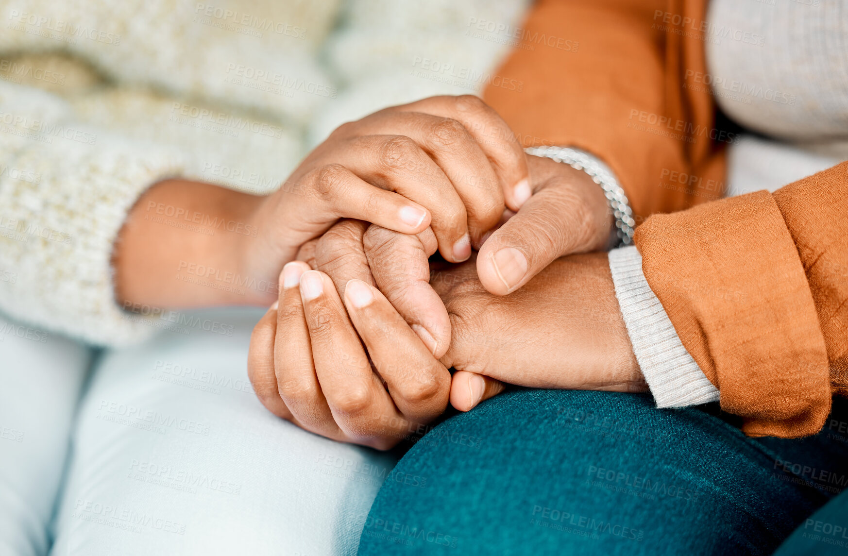 Buy stock photo Shot of two unrecognizable women holding hands together outside