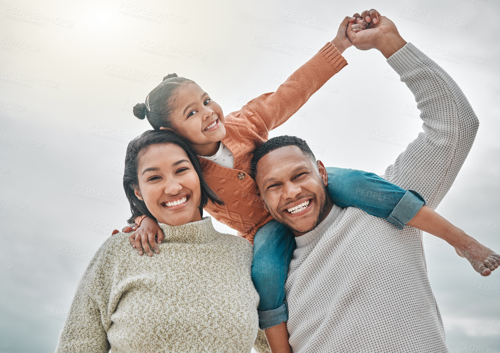 Buy stock photo Family, holding hands and piggyback portrait at beach, mother and father for ocean holiday. People, bonding and love for sea waves in outdoor vacation, happiness and carrying game together in nature