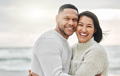 Buy stock photo Cropped shot of an affectionate young couple sharing an intimate moment on the beach