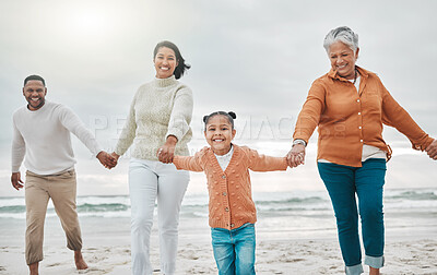Buy stock photo Cropped shot of an adorable little girl pulling her parents and grandmother along the beach