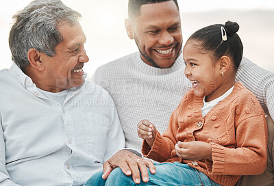 Buy stock photo Cropped shot of an adorable little girl on the beach with her father and grandfather
