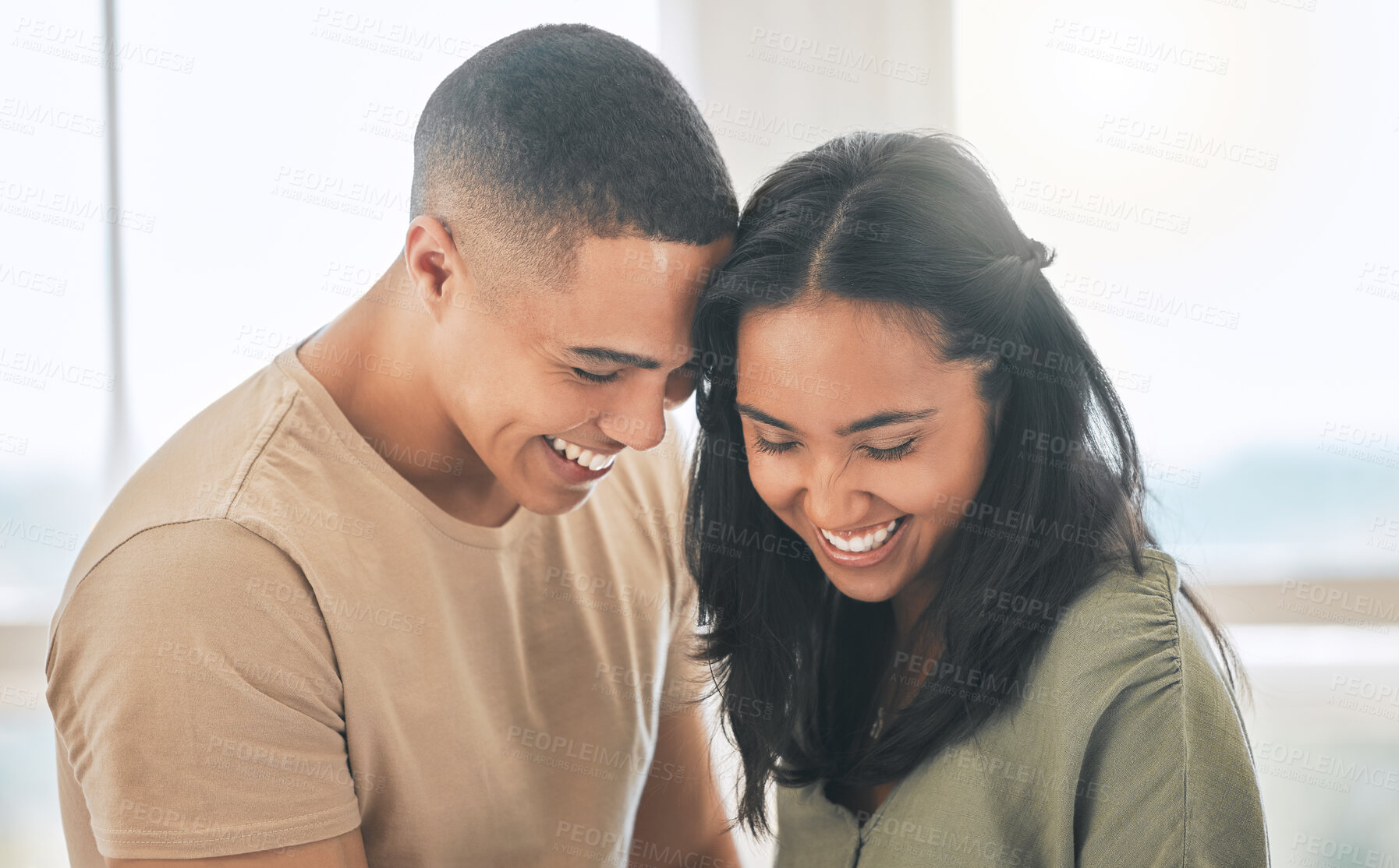 Buy stock photo Couple, smile and laughing in home for love, intimacy and relax for romance, bonding and trust together. Young man, woman and happy partner with care, quality time or happiness in loving relationship