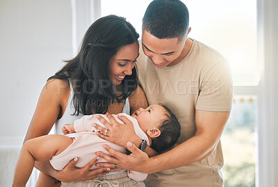 Buy stock photo Mother, father and holding baby in a family home for bonding, security and quality time. Happy woman, man and girl child relax together in a house for development, trust and support or care and love