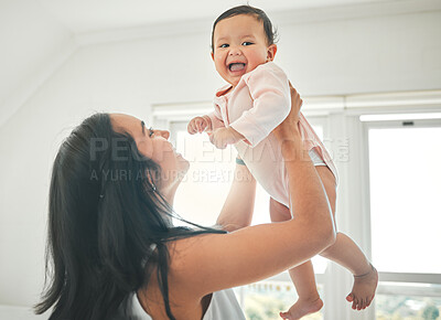 Buy stock photo Mother, lifting baby and happy in a family home with love, fun and quality time. Woman or mom and child relax and laugh together in a house for development, trust and support or care on mothers day