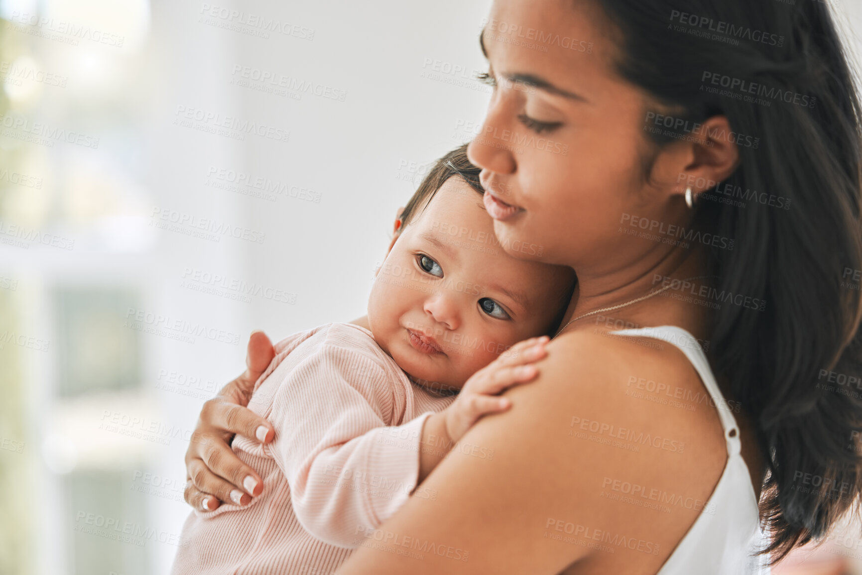 Buy stock photo Mother, holding baby and love in a family home for bonding, security and quality time. Woman or mom and girl child relax together in a house for development, trust and support or care on mothers day
