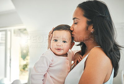 Buy stock photo Mother, holding baby and kiss in a family home for love, security and quality time. Woman or mom and girl child relax together in a house for development, trust and support or care on mothers day