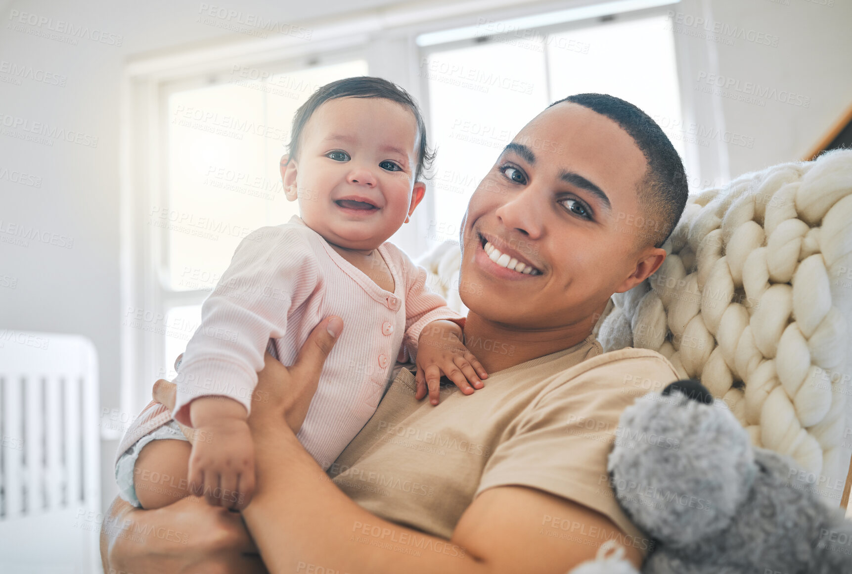 Buy stock photo Dad, holding baby and portrait in a family home for bonding, security and quality time. Man or father and girl child relax and smile together on lounge sofa for development, trust and support or care