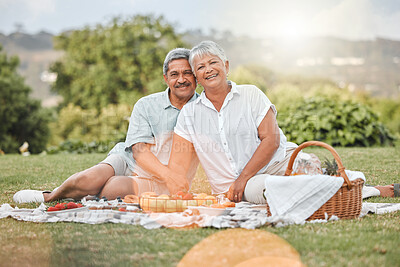Buy stock photo Shot of a mature couple enjoying a picnic