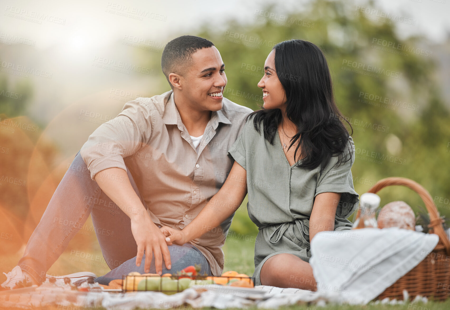 Buy stock photo Happy, nature and couple on picnic for date with romance on vacation, getaway or weekend trip. Love, basket and young man and woman with connection, bonding and marriage activity in outdoor park.