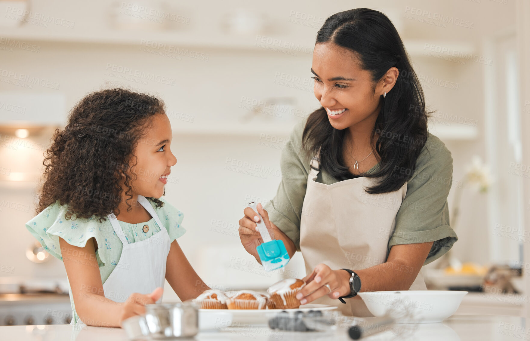 Buy stock photo Baking, cupcake and mom with girl in kitchen with icing for cake, treats and dessert for bonding relationship. Family, home and mother and child with ingredients, recipe and learning for fun together